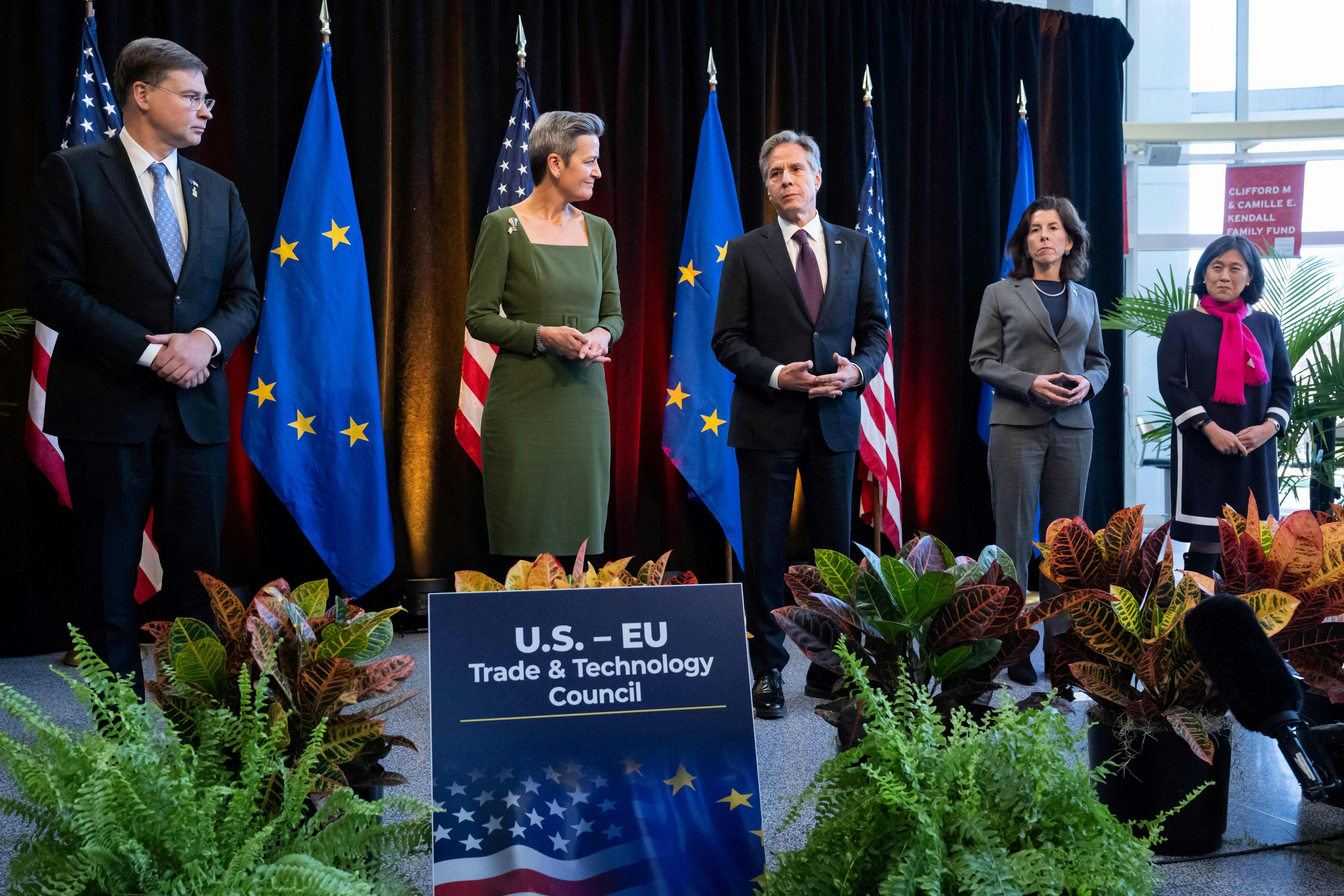 US and European leaders stand on stage at a recent tech summit.
